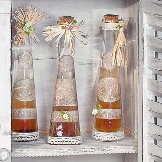 Pastel coloured glass bottles in country house style