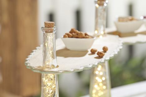 Serving table with filled bottles - VBS Hobby